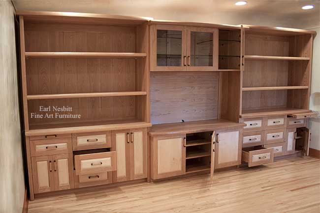 custom made cabinets with some doors and drawers open